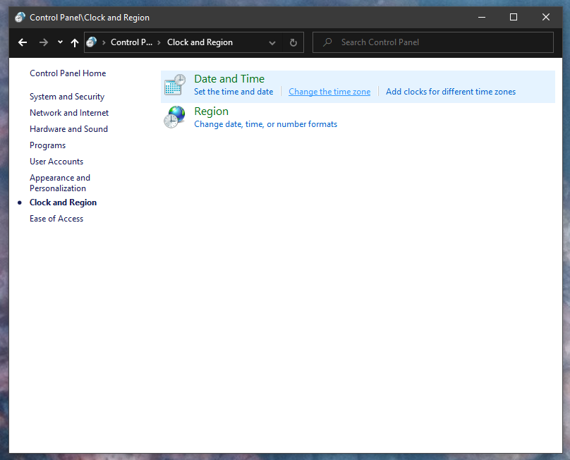 Windows Control Panel showing Clock and Region category.