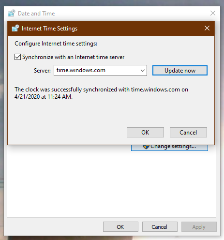 Internet Time Settings dialog showing successful synchronization message